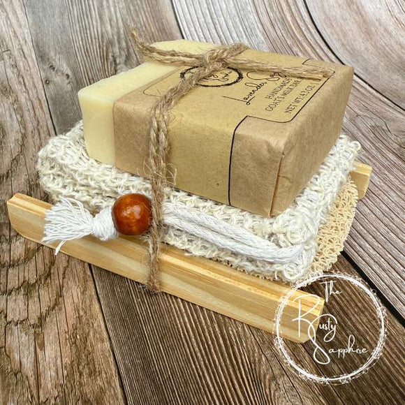 Bar of soap on a wooden stand with a rustic background